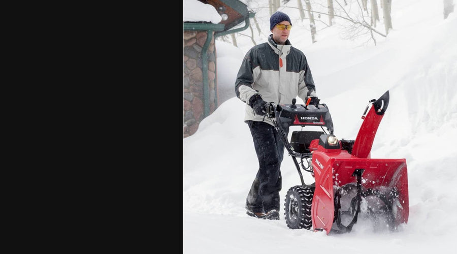 Honda snow blower clearing snow